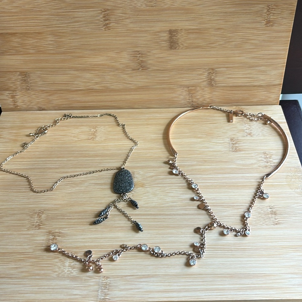 Bundle of 2 rose gold in color necklaces.